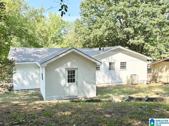 back of property with central AC