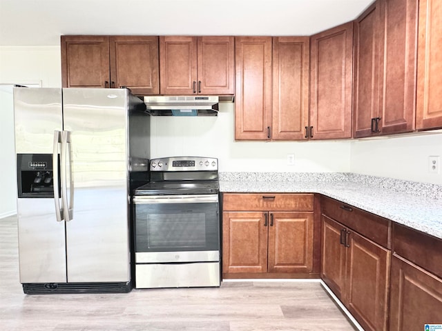 kitchen with light stone counters, stainless steel appliances, crown molding, and light hardwood / wood-style floors