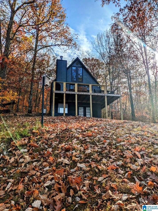 back of house with a balcony