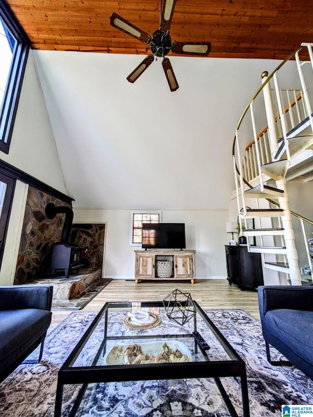 living room featuring high vaulted ceiling, wood-type flooring, ceiling fan, and wooden ceiling