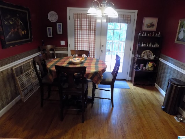 dining space with hardwood / wood-style flooring