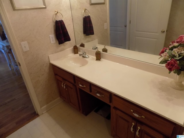 bathroom with hardwood / wood-style floors and vanity