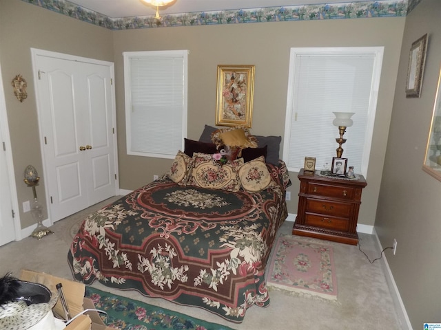 bedroom featuring light carpet