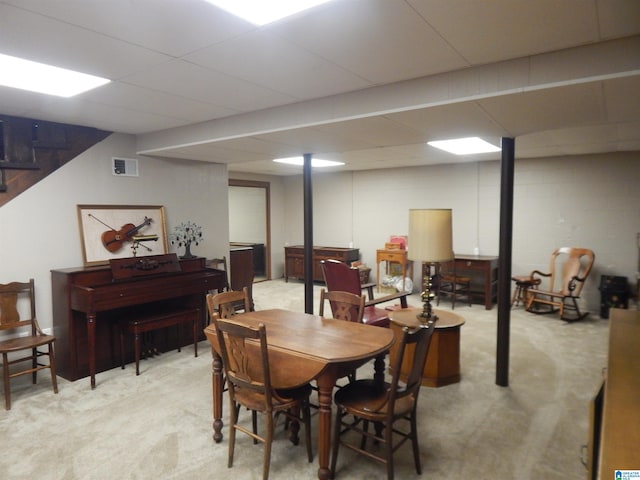 dining space featuring light colored carpet