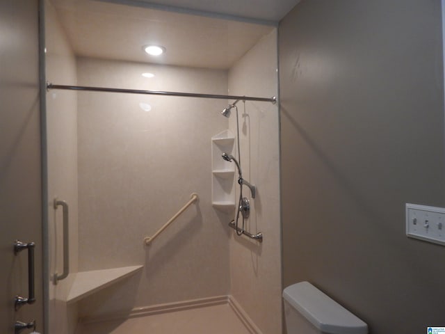 bathroom with walk in shower and toilet