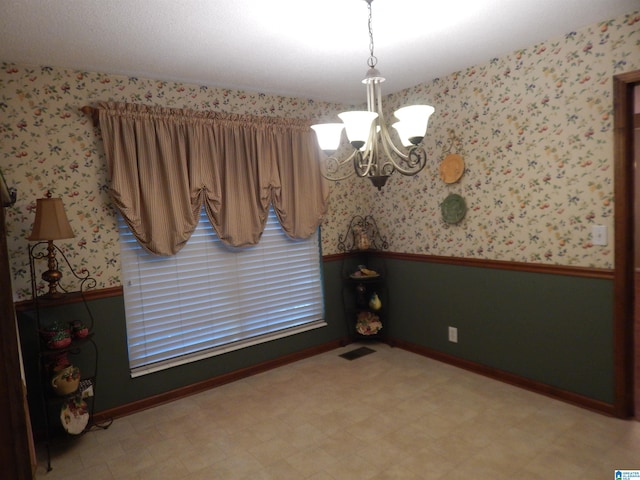 dining space with a notable chandelier