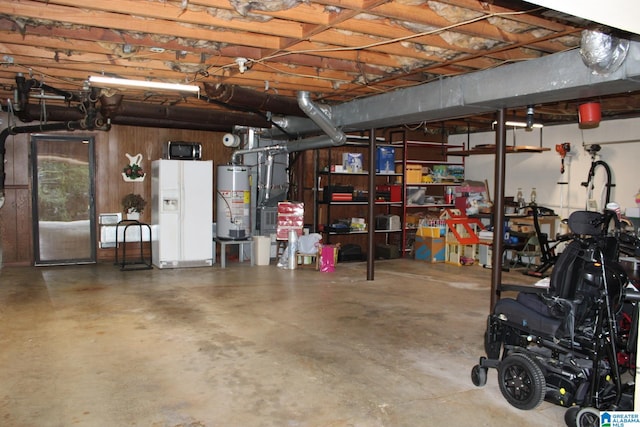 garage with white fridge with ice dispenser and water heater