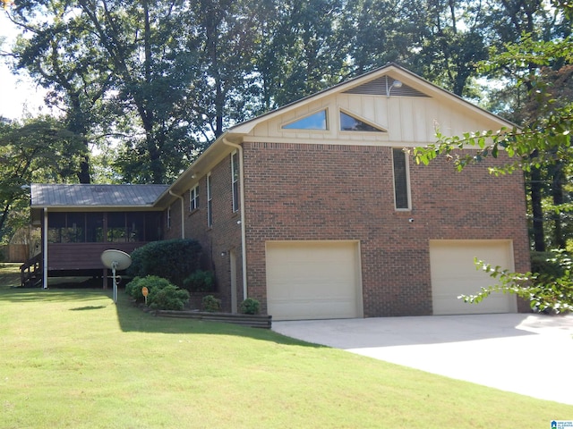 view of front of house with a front lawn and a garage