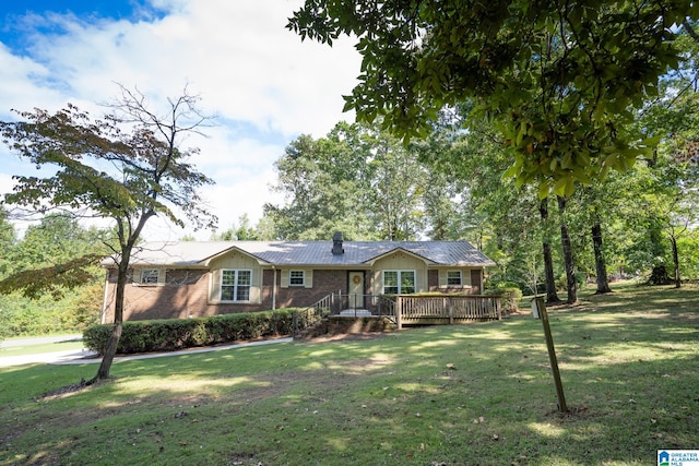 ranch-style home with a deck and a front lawn