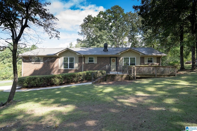 ranch-style house featuring a front yard and a deck