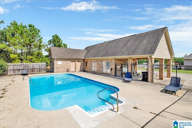 view of swimming pool with a patio