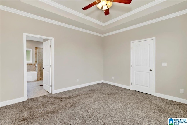 empty room featuring carpet floors, crown molding, and ceiling fan