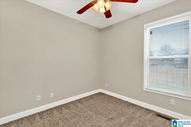 unfurnished room featuring ceiling fan and carpet flooring