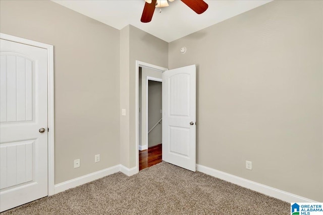 unfurnished bedroom with carpet and ceiling fan