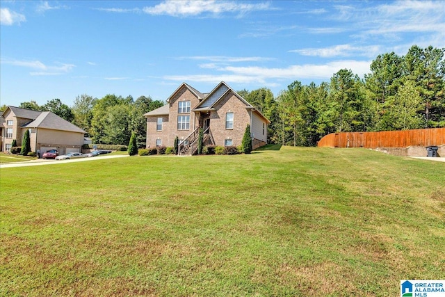 view of front of property featuring a front yard and a garage