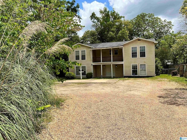 rear view of house featuring a balcony