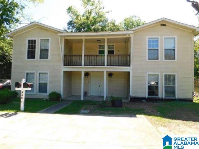 front of property featuring a balcony