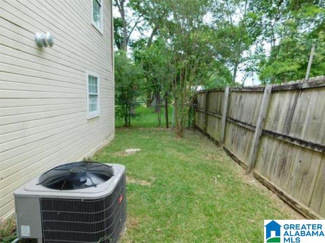 view of yard featuring central air condition unit