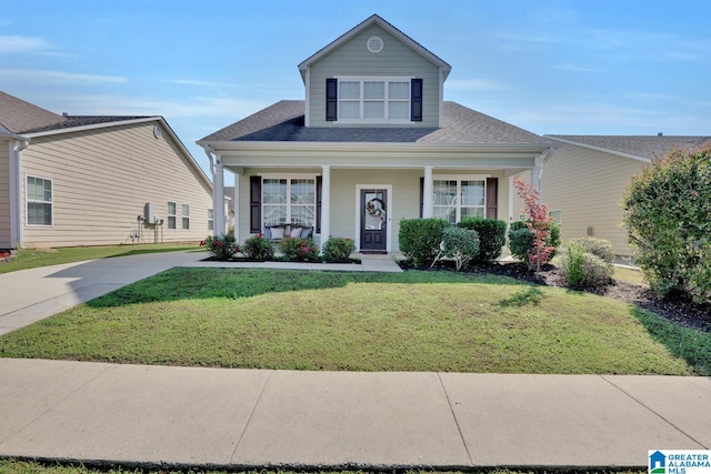 view of front of home featuring a front yard and a porch