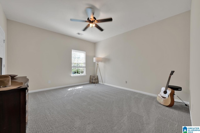 interior space featuring ceiling fan and light colored carpet