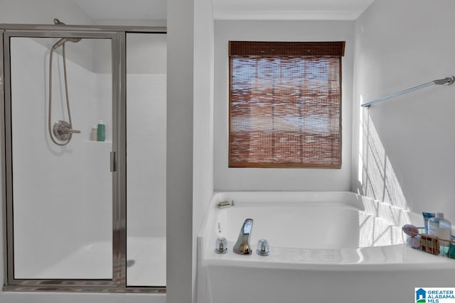 bathroom with shower with separate bathtub