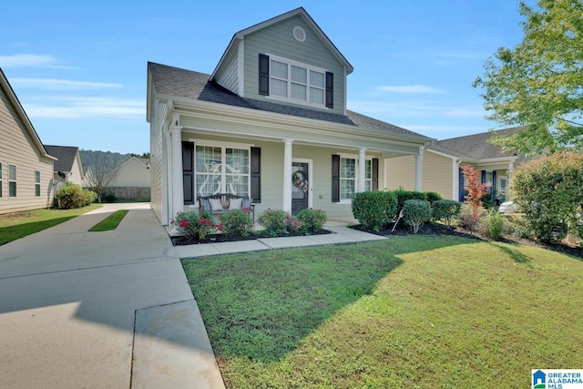 view of front of house with a front lawn and covered porch