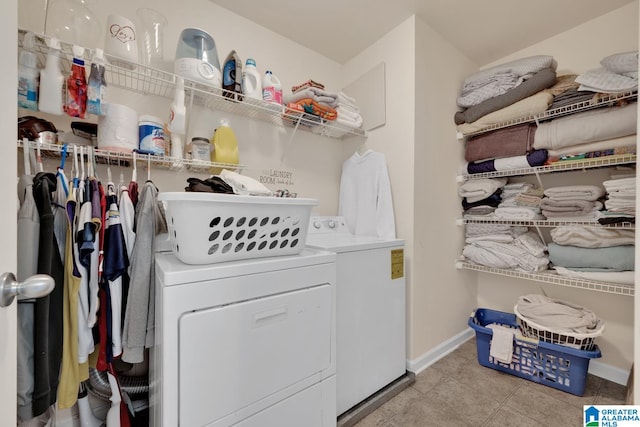 washroom featuring light tile patterned floors and washing machine and clothes dryer