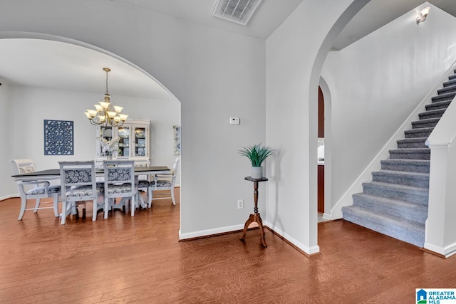 dining space featuring a chandelier and hardwood / wood-style flooring