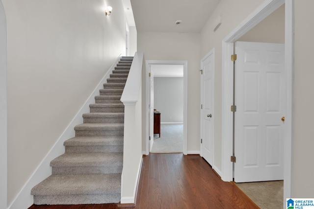 staircase featuring hardwood / wood-style floors