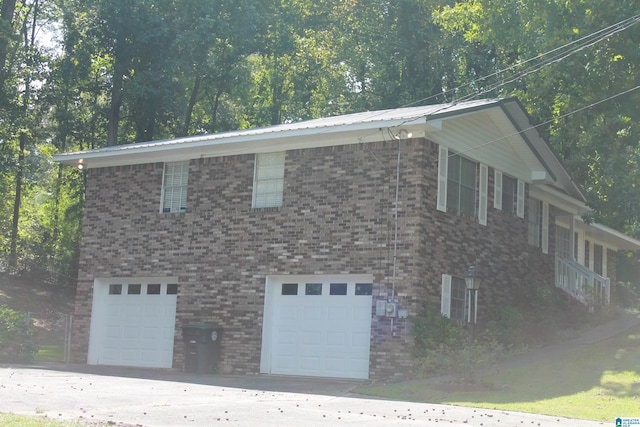 view of property exterior with a garage