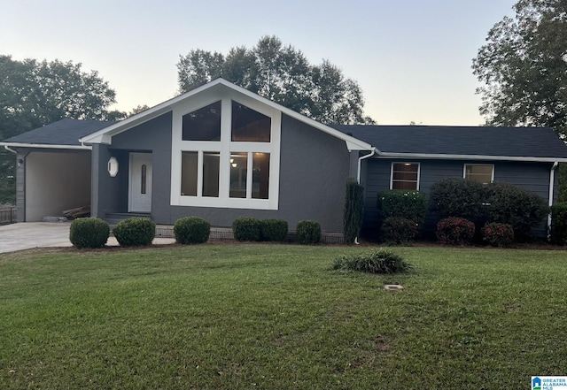 ranch-style house featuring a lawn