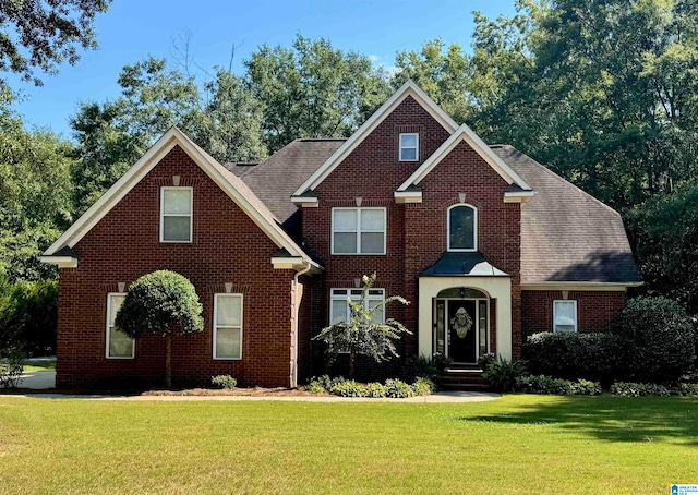 view of property featuring a front yard