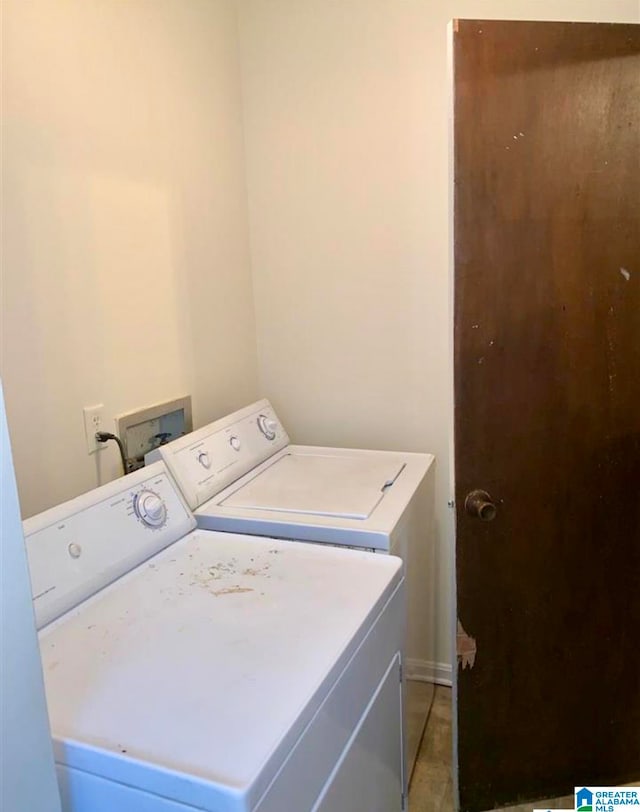 laundry area featuring washing machine and clothes dryer