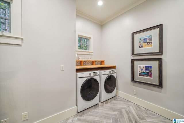 laundry area featuring washing machine and clothes dryer, ornamental molding, light parquet flooring, and a wealth of natural light