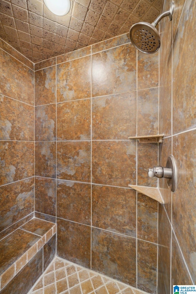 bathroom with tiled shower