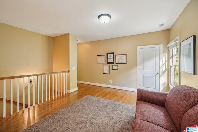 living area with light hardwood / wood-style flooring