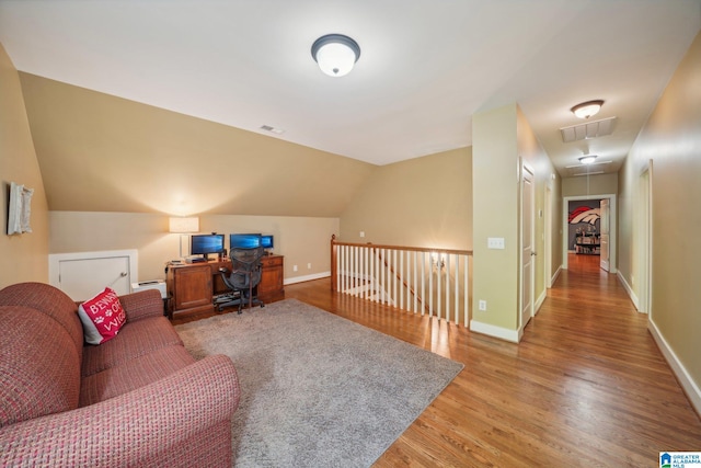 office area with lofted ceiling and hardwood / wood-style floors