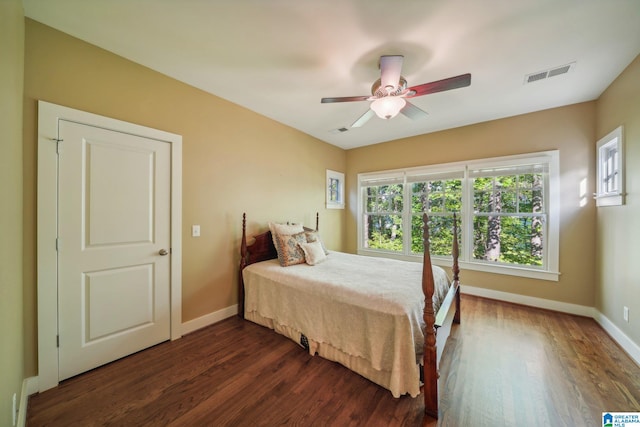 bedroom featuring dark hardwood / wood-style flooring and ceiling fan