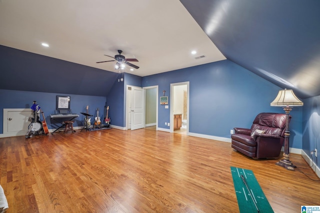 unfurnished room featuring ceiling fan, lofted ceiling, and hardwood / wood-style floors