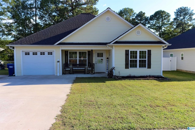 view of front of property with a garage, a front lawn, and a porch