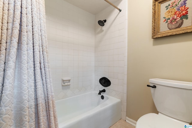 bathroom with shower / bath combo with shower curtain and toilet