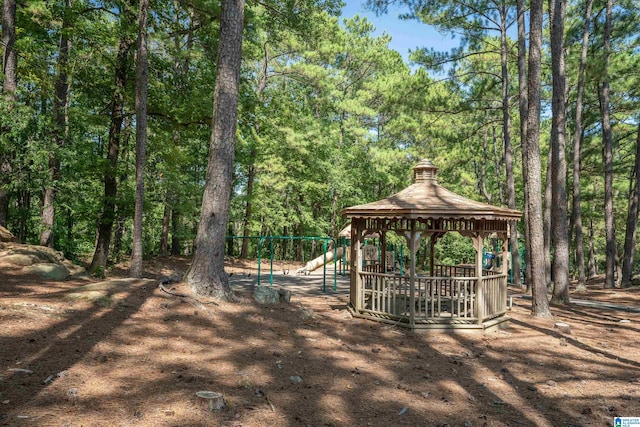 view of property's community featuring a playground and a gazebo