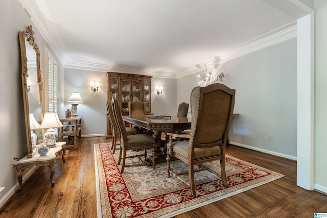 dining area featuring crown molding and dark hardwood / wood-style flooring