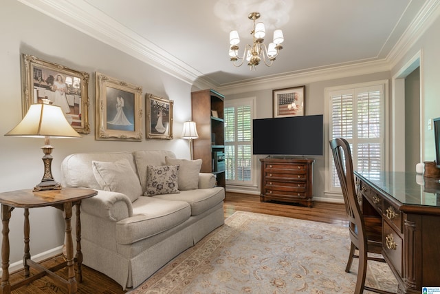 living room featuring a notable chandelier, light hardwood / wood-style flooring, and ornamental molding