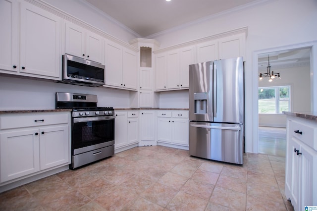 kitchen featuring white cabinetry, an inviting chandelier, appliances with stainless steel finishes, and crown molding