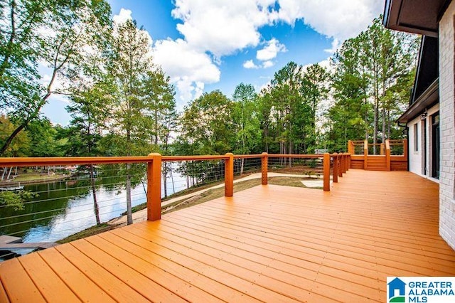 wooden deck with a water view