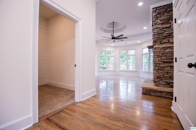 hall featuring light wood finished floors, baseboards, and recessed lighting