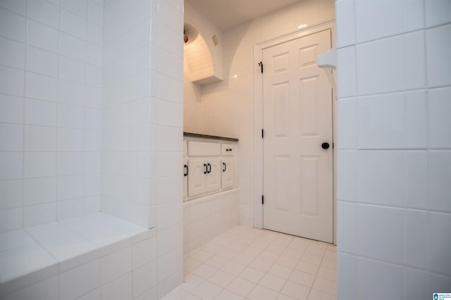 bathroom featuring tile walls and tile patterned floors