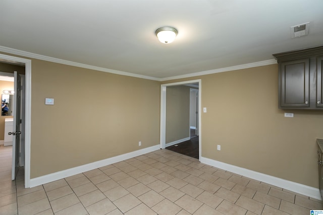 spare room with crown molding