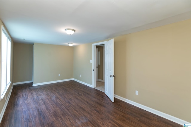 empty room featuring dark hardwood / wood-style floors